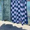 Beach towel on a rail by the sea