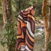 Beach towel hanging from a tree