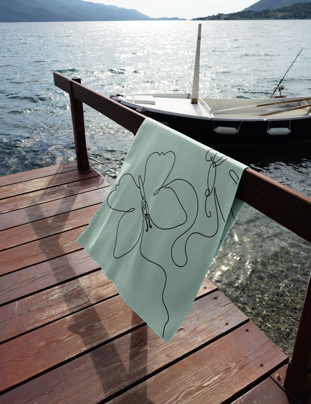 44 Beach towel on a rail by the sea