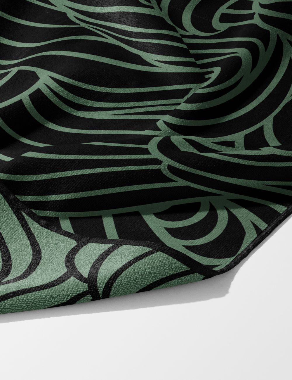60 Swell Earth earthy gym towel – white background, zoomed in bottom right, corner folded to show reverse